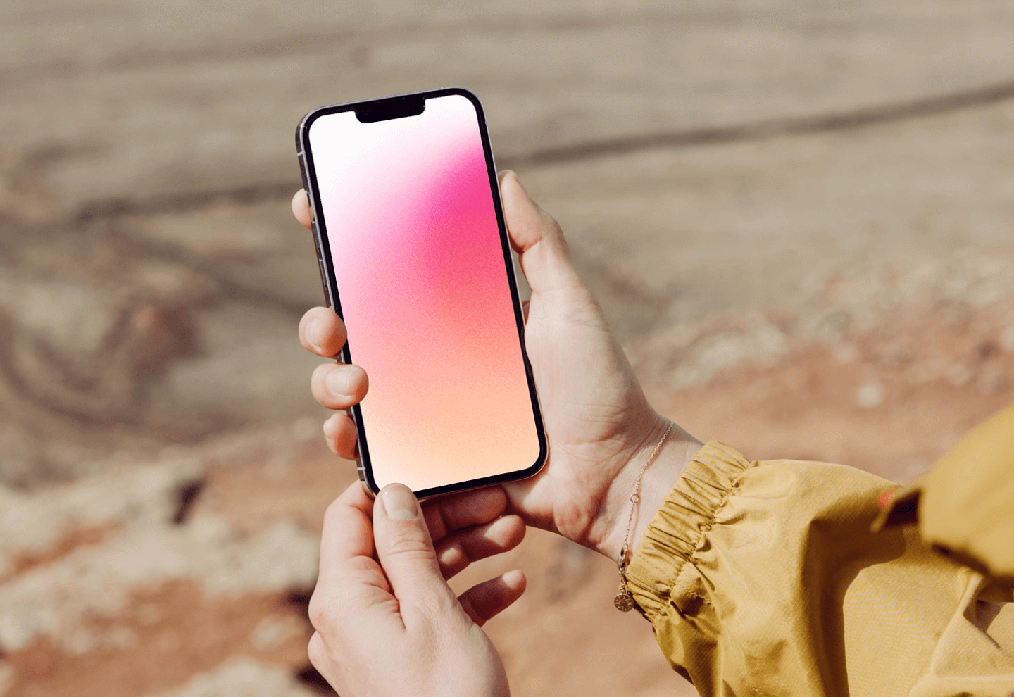 Woman holding iPhone mockup